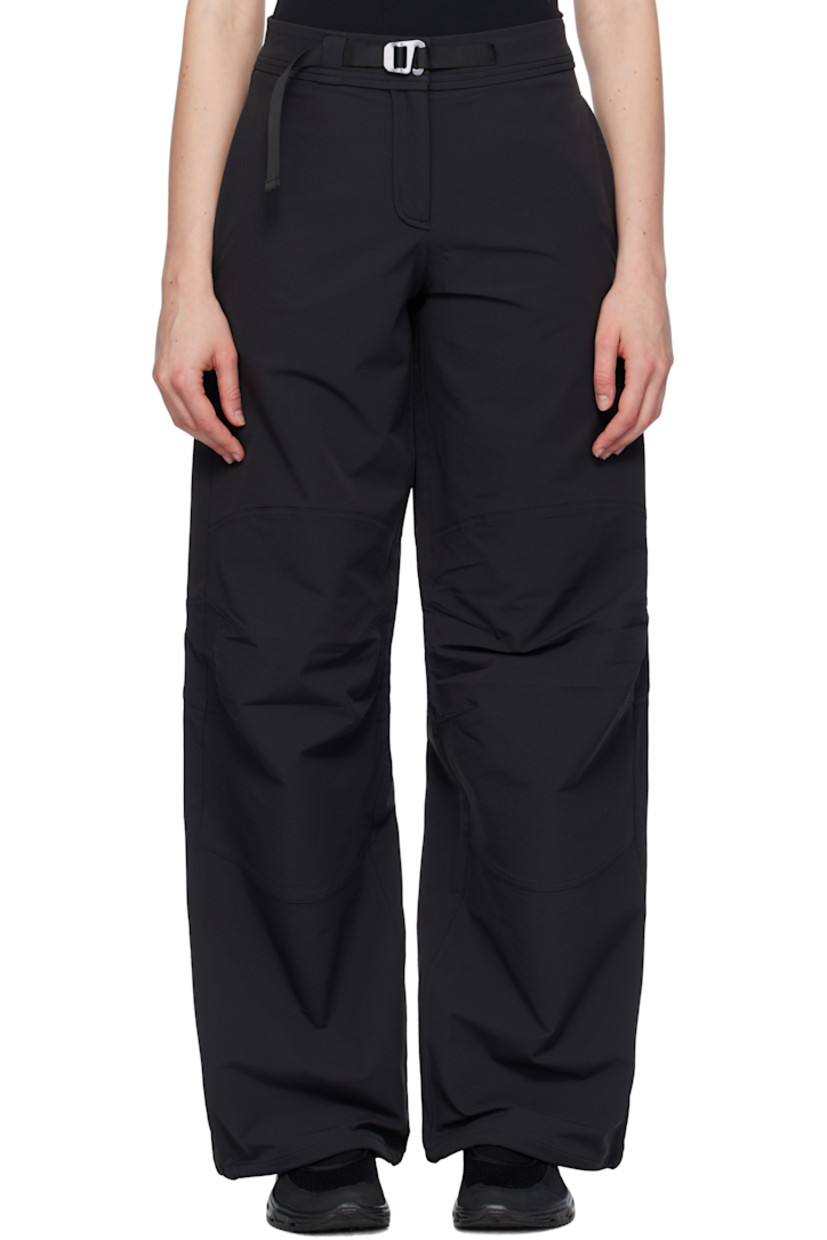 Stretch nylon taffeta sport pants.

· Water-repellent 
· Loose-fit 
· Integrated cinch belt 
· Two-pocket styling
· Zip fly 
· Darts at knees
· Bungee-style drawstring at cuffs
· Logo embroidered at back

Supplier color: Black