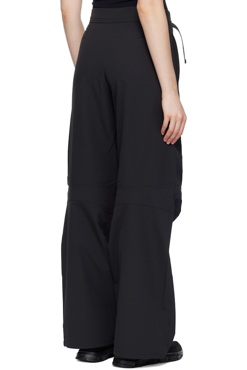 Stretch nylon taffeta sport pants.

· Water-repellent 
· Loose-fit 
· Integrated cinch belt 
· Two-pocket styling
· Zip fly 
· Darts at knees
· Bungee-style drawstring at cuffs
· Logo embroidered at back

Supplier color: Black