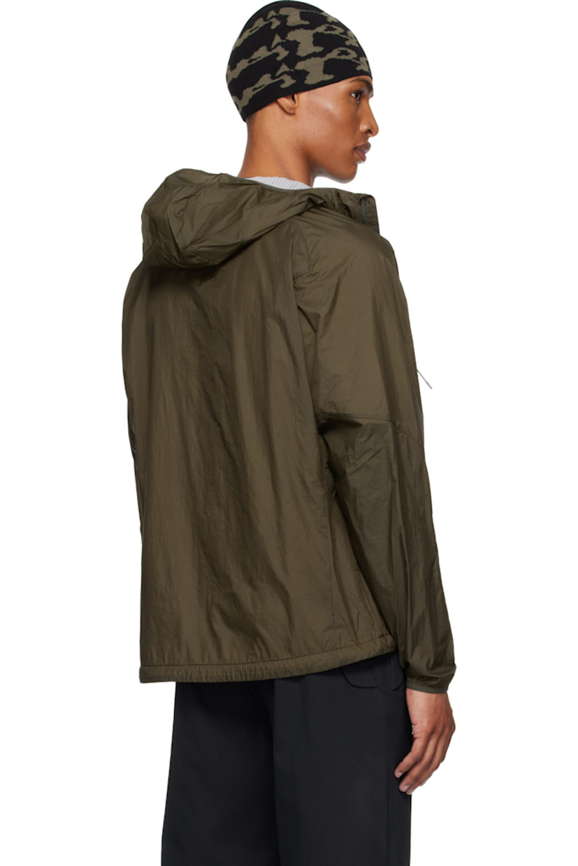Insulated nylon ripstop jacket. 

· Lightweight 
· Water repellent and windproof
· Waffle-knit Polartec® Power Dry® lining at hood
· Stand collar
· Two-way zip closure
· Zip pockets
· Embroidered logo at front hem and cuff
· Elasticized hem and cuffs
· Bungee-style drawstring at hem
· Unlined raglan sleeves
· Waffle-knit Polartec® Power Dry® lining

Supplier color: Dark olive
