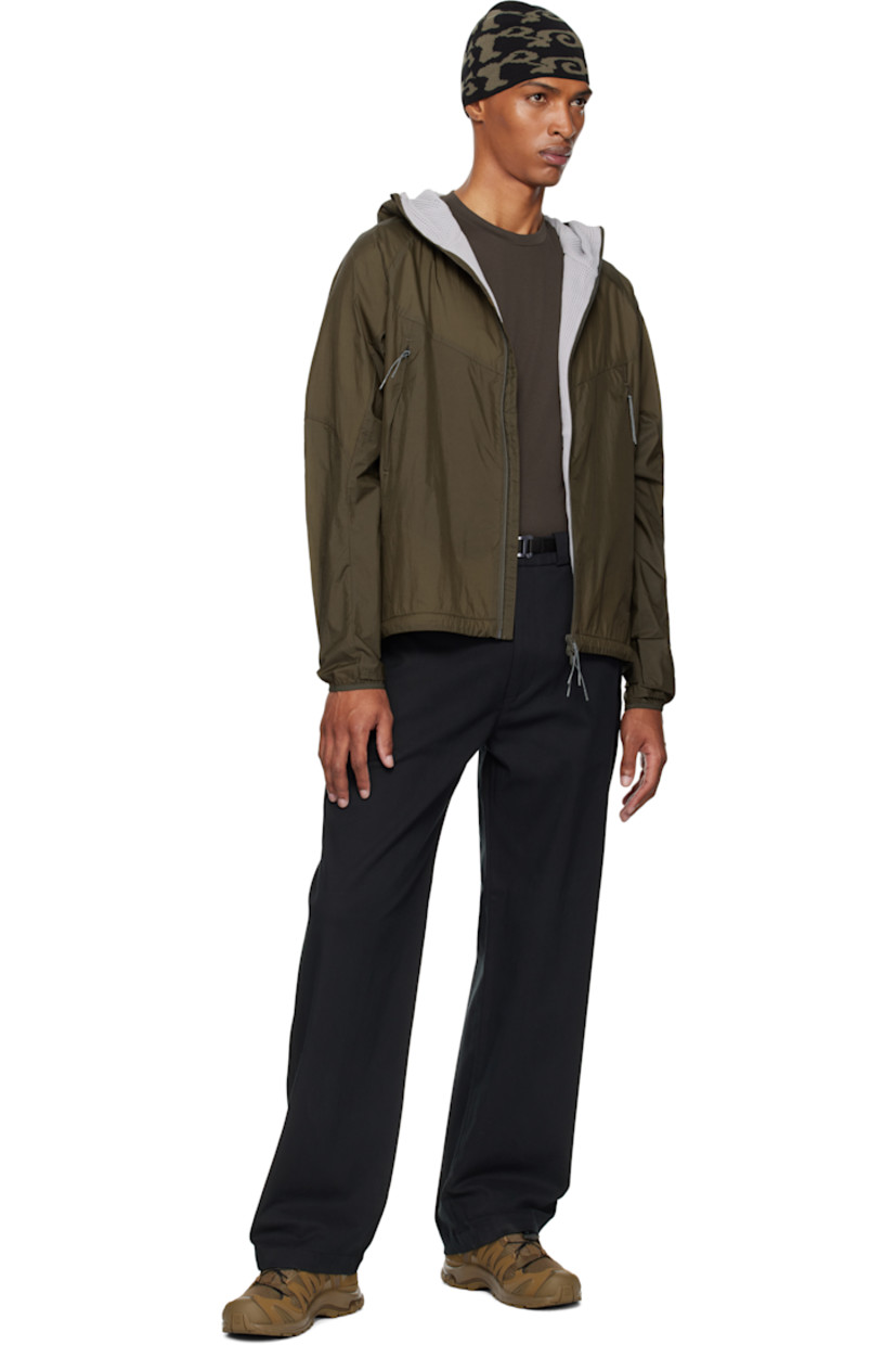 Insulated nylon ripstop jacket. 

· Lightweight 
· Water repellent and windproof
· Waffle-knit Polartec® Power Dry® lining at hood
· Stand collar
· Two-way zip closure
· Zip pockets
· Embroidered logo at front hem and cuff
· Elasticized hem and cuffs
· Bungee-style drawstring at hem
· Unlined raglan sleeves
· Waffle-knit Polartec® Power Dry® lining

Supplier color: Dark olive