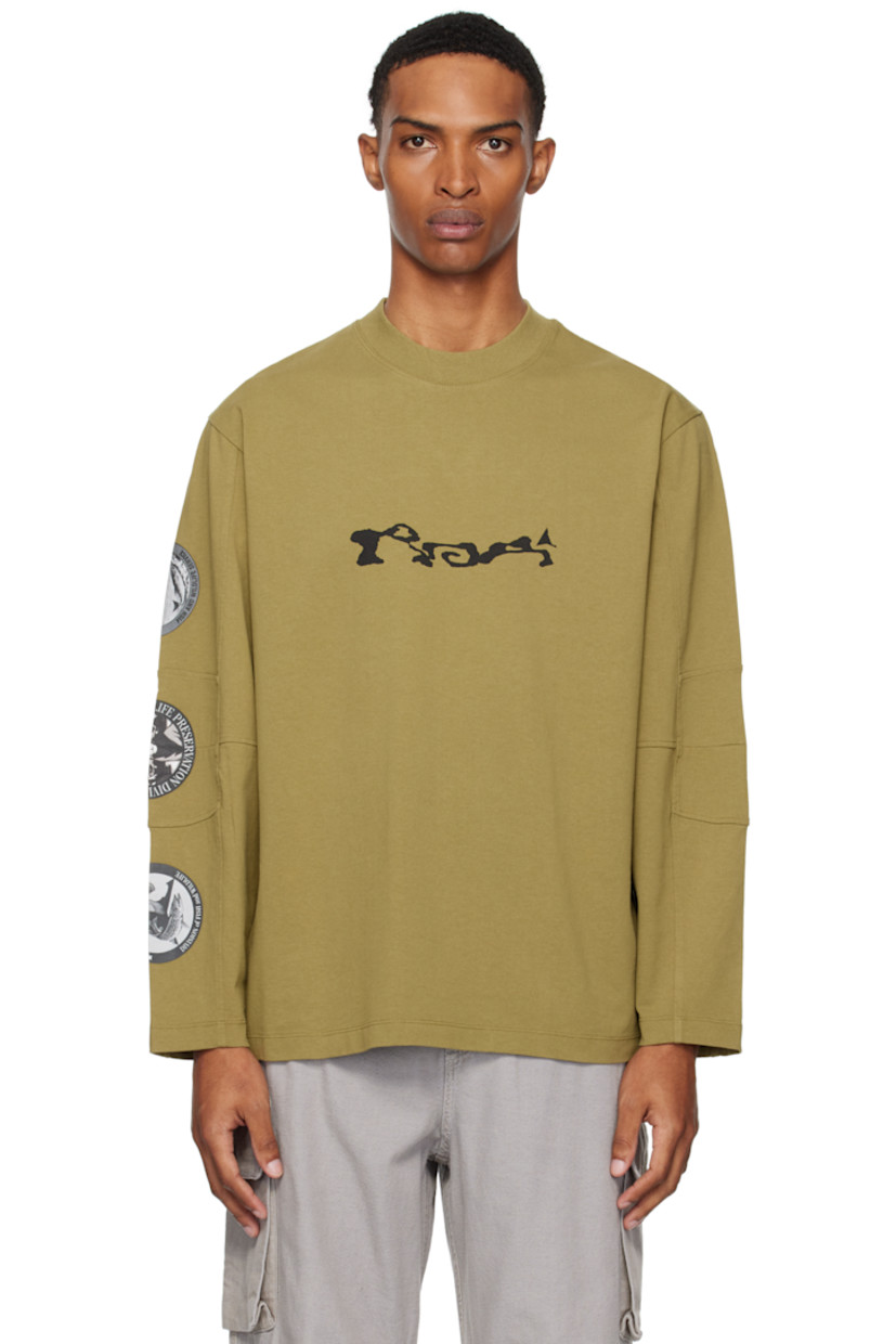 Heavyweight cotton jersey T-shirt.

· Rib-knit crewneck
· Logo printed at chest
· Paneled sleeves
· Printed graphics at sleeve
· Raised text and printed graphics at back

Supplier color: Olive drab