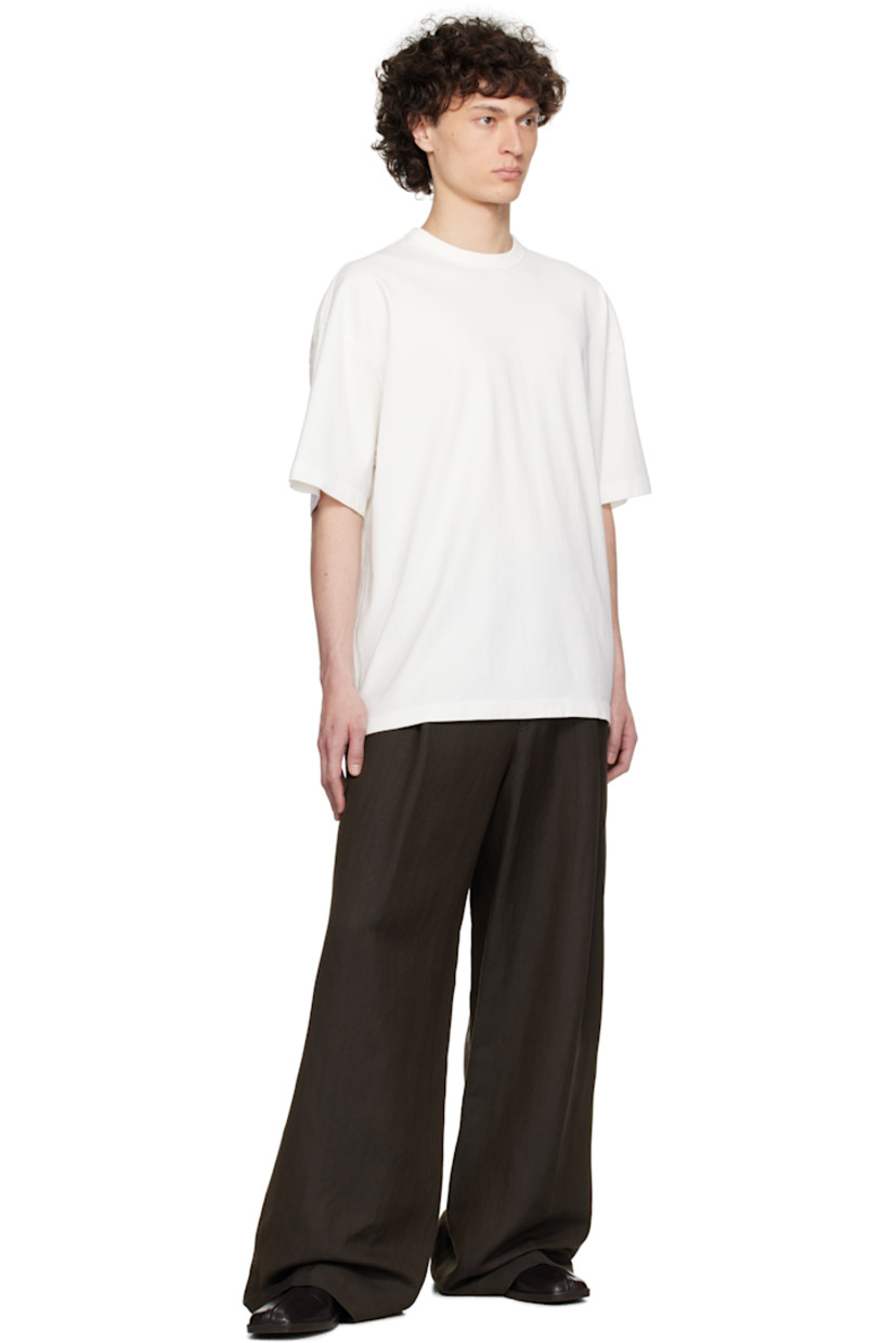 Pigment-dyed cotton jersey T-shirt. 

· Boxy-fit 
· Rib-knit crewneck
· Tennis-tail hem
· Dropped shoulders

Supplier color: White