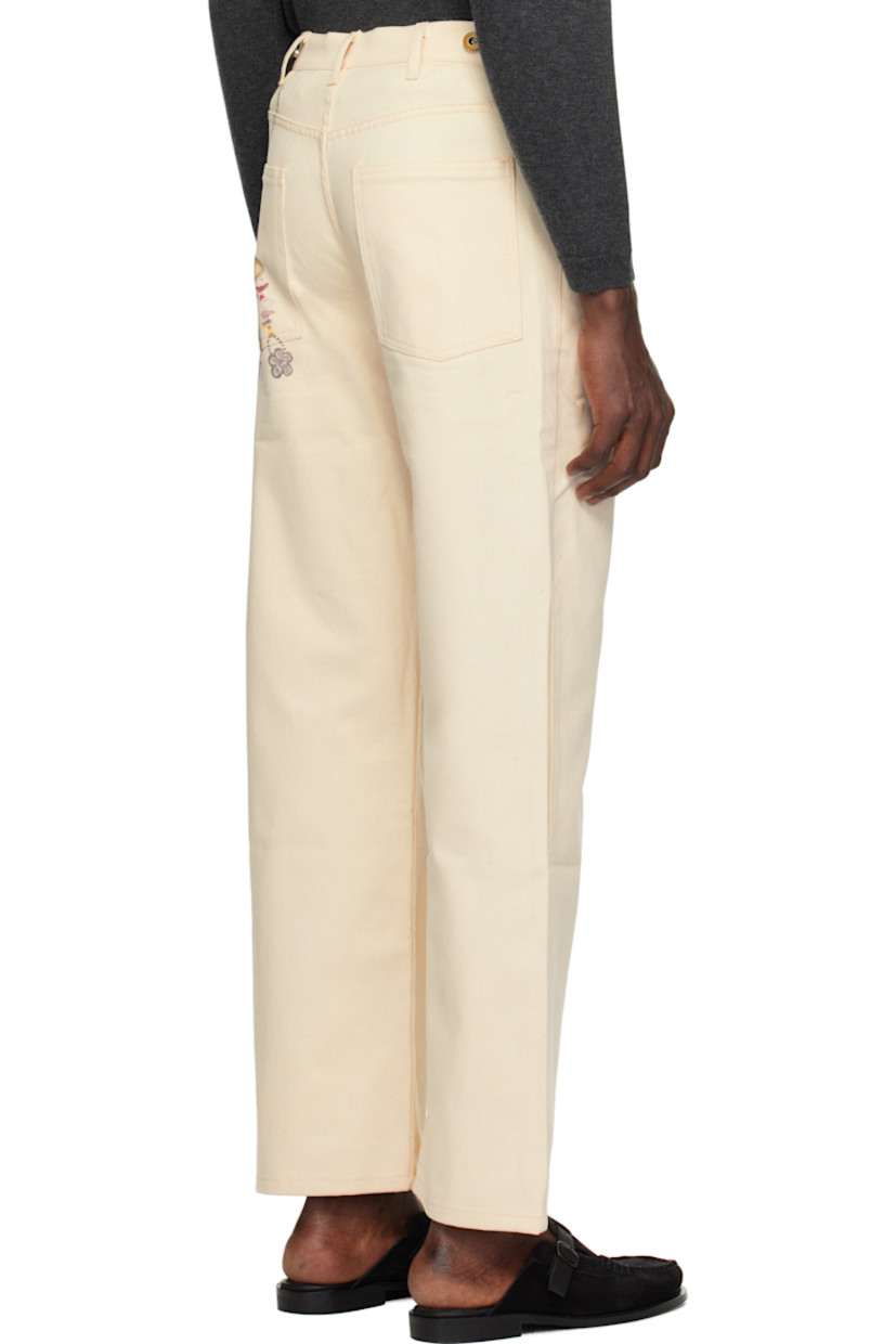 Non-stretch denim jeans. 

· Belt loops
· Adjustable button tabs at waistband
· Five-pocket styling
· Zip fly
· Printed graphic at front and back

Supplier color: Off white
