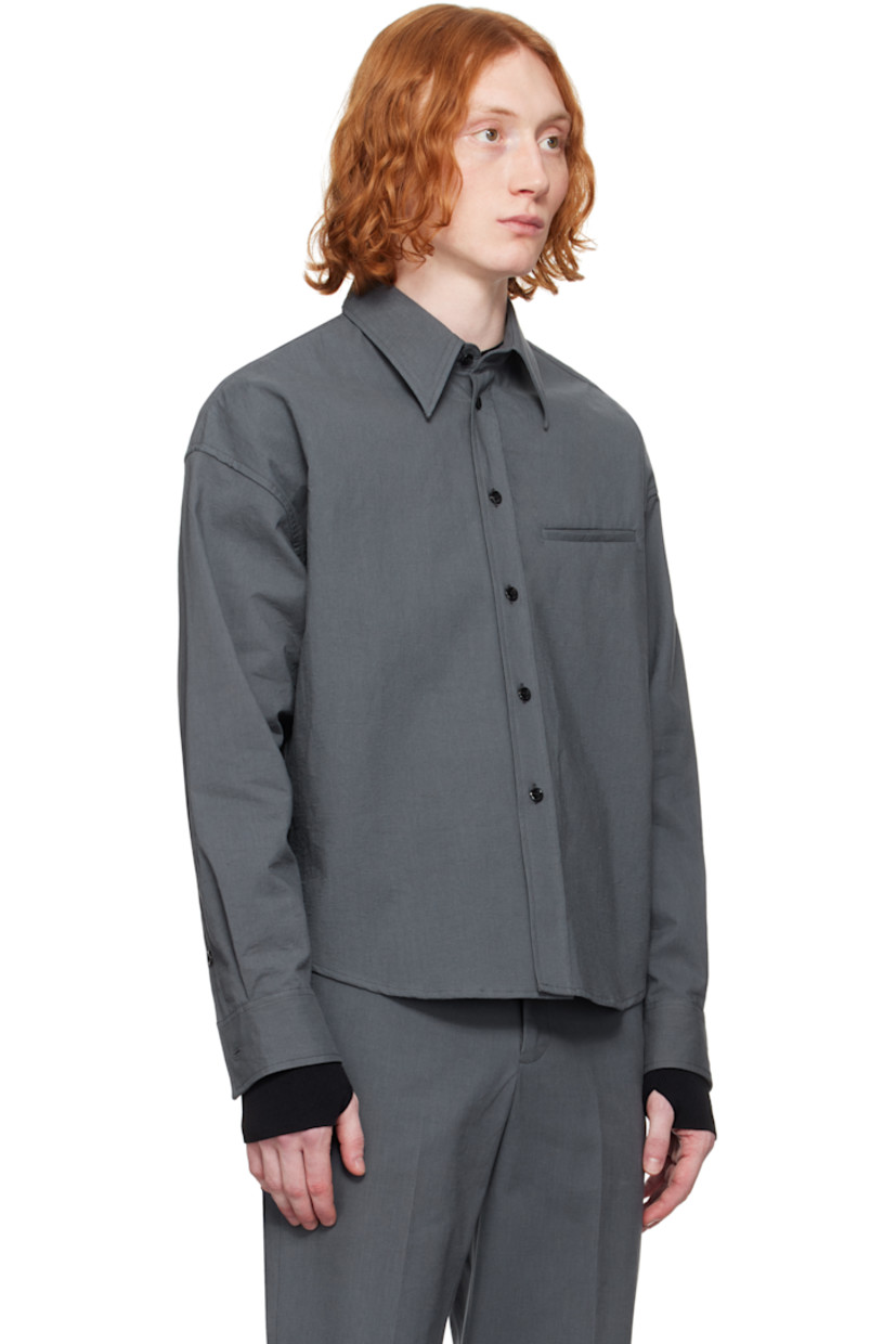 Crinkled plain-woven cotton shirt.

· Spread collar
· Button closure
· Welt pocket
· Shirttail hem
· Dropped shoulders
· Single-button barrel cuffs
· Flap pocket and twin pleats at back yoke

Supplier color: Gray