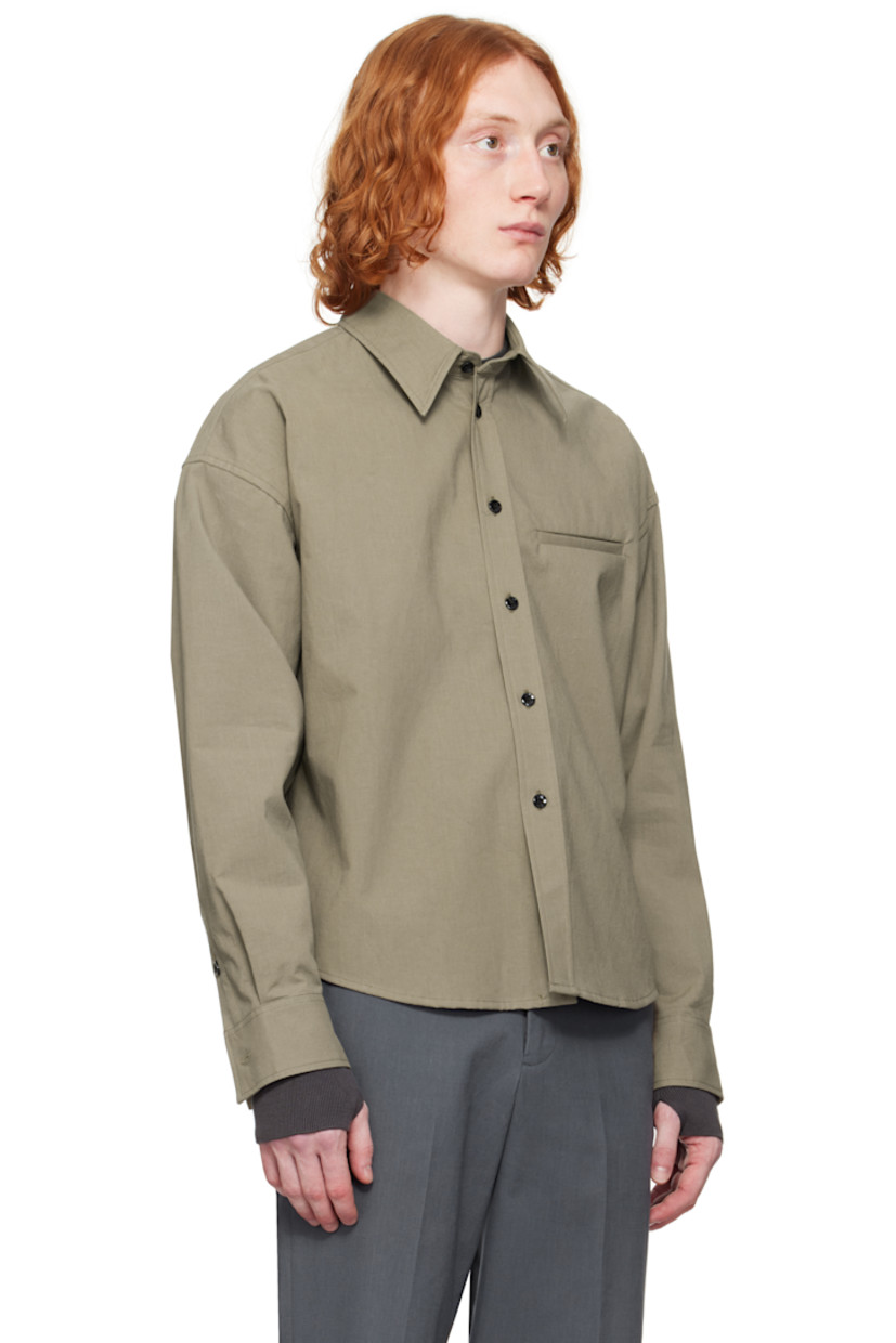 Crinkled plain-woven cotton shirt.

· Spread collar
· Button closure
· Welt pocket
· Shirttail hem
· Dropped shoulders
· Single-button barrel cuffs
· Flap pocket and twin pleats at back yoke

Supplier color: Taupe
