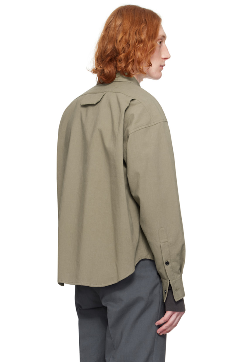 Crinkled plain-woven cotton shirt.

· Spread collar
· Button closure
· Welt pocket
· Shirttail hem
· Dropped shoulders
· Single-button barrel cuffs
· Flap pocket and twin pleats at back yoke

Supplier color: Taupe