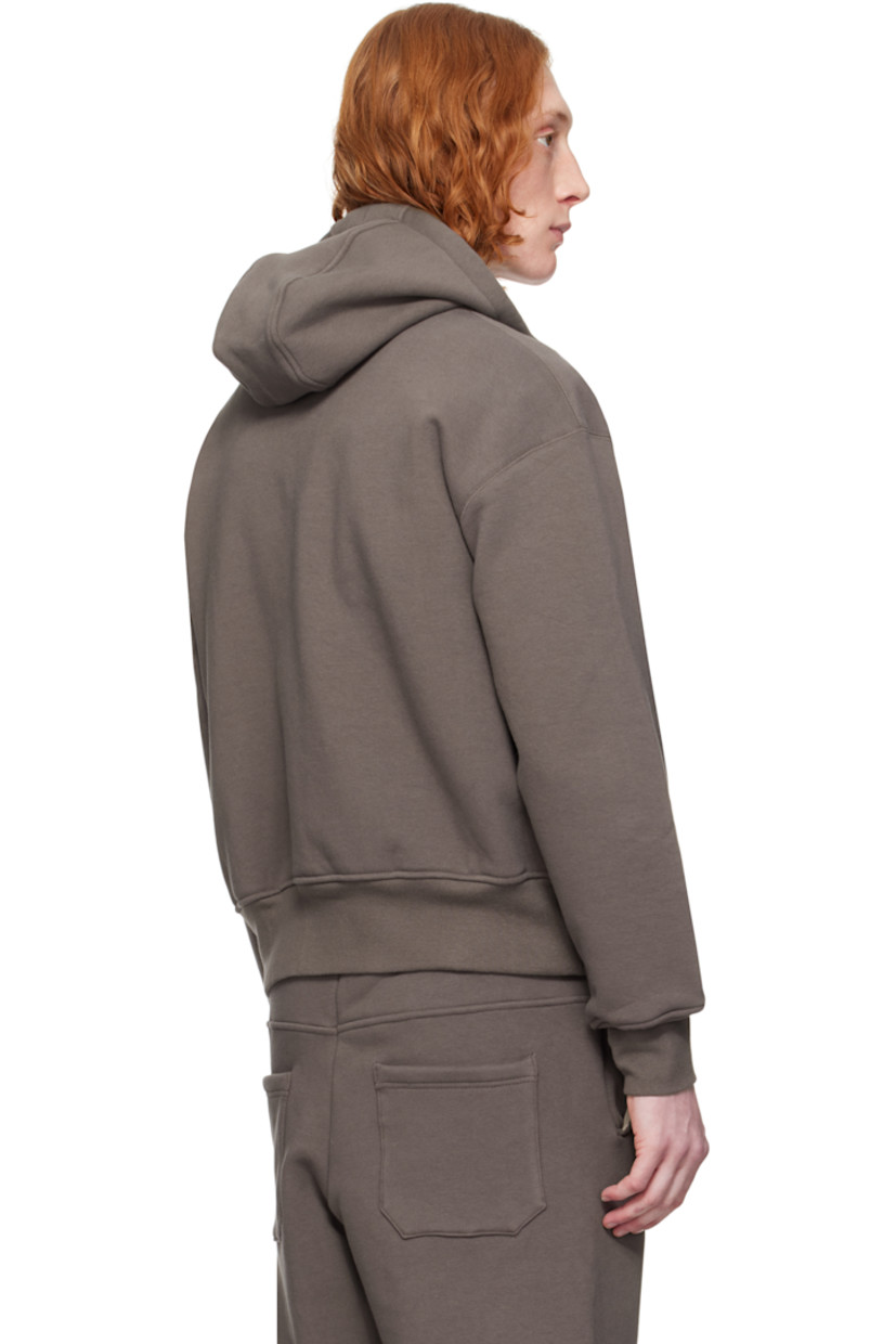 Heavyweight stretch French terry hoodie. 

· Bungee-style drawstring and jersey lining at hood
· Two-way zip closure
· Welt pockets
· Rib-knit hem and cuffs
· Dropped shoulders
· Thumbhole at cuffs
· Silver-tone hardware

Supplier color: Brown
