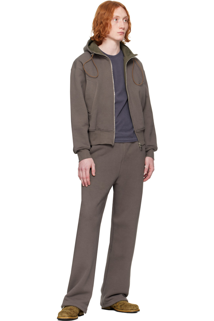 Heavyweight stretch French terry hoodie. 

· Bungee-style drawstring and jersey lining at hood
· Two-way zip closure
· Welt pockets
· Rib-knit hem and cuffs
· Dropped shoulders
· Thumbhole at cuffs
· Silver-tone hardware

Supplier color: Brown