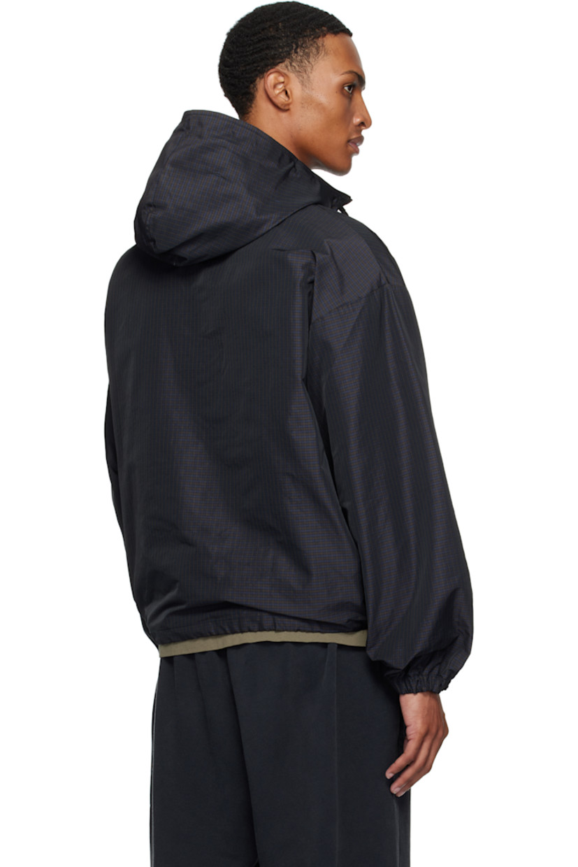 Polyester twill anorak. Check pattern throughout.

· Integrated logo-embroidered balaclava at hood
· Drawstring at stand collar and hem 
· Half-zip closure
· Logo embroidered at chest
· Kangaroo pocket with logo flag at waist
· Dropped shoulders
· Elasticized cuffs
· Unlined

Supplier color: Navy/Dark Brown