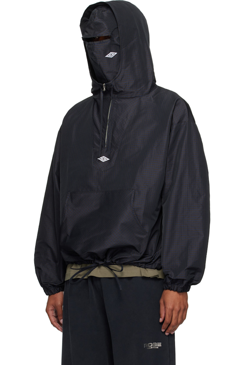 Polyester twill anorak. Check pattern throughout.

· Integrated logo-embroidered balaclava at hood
· Drawstring at stand collar and hem 
· Half-zip closure
· Logo embroidered at chest
· Kangaroo pocket with logo flag at waist
· Dropped shoulders
· Elasticized cuffs
· Unlined

Supplier color: Navy/Dark Brown