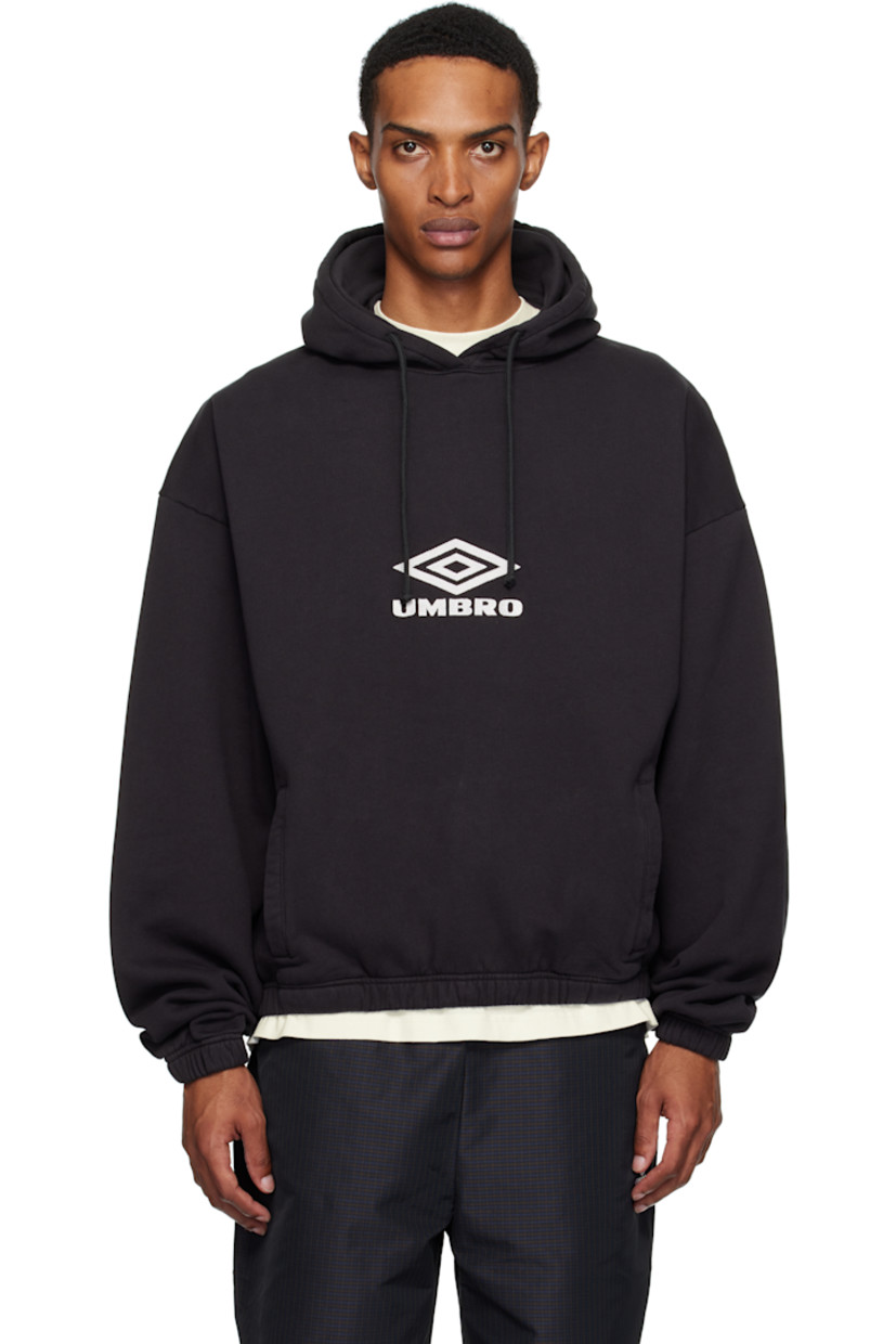 Heavyweight cotton fleece hoodie. 

· Drawstring and integrated balaclava at hood
· Embroidered logo at front
· Welt pockets at waist
· Elasticized hem and cuffs
· Dropped shoulders

Supplier color: Black