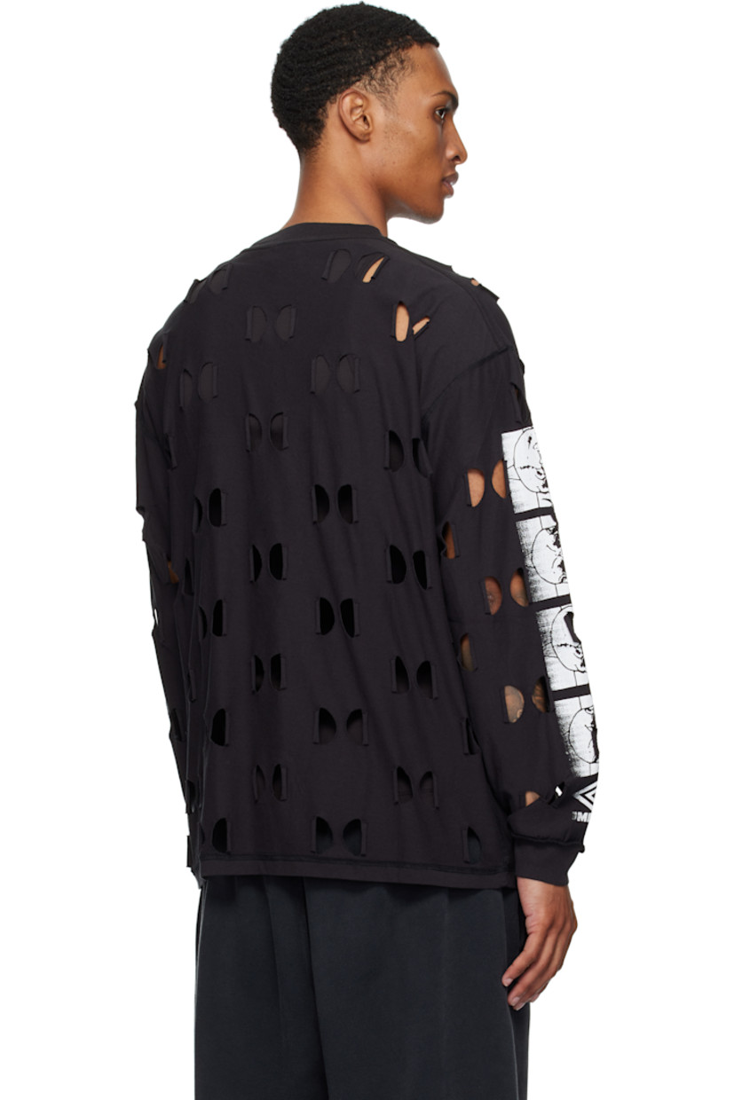 Cotton jersey T-shirt.

· Raw-edge cutout pattern throughout 
· Inverted seams throughout
· Rib-knit crewneck and cuffs
· Text printed at chest
· Printed graphics at sleeves

Supplier color: Black
