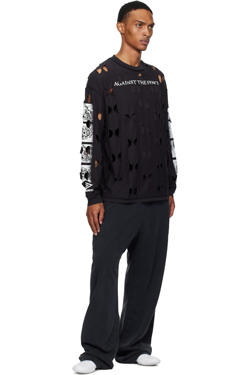 Cotton jersey T-shirt.

· Raw-edge cutout pattern throughout 
· Inverted seams throughout
· Rib-knit crewneck and cuffs
· Text printed at chest
· Printed graphics at sleeves

Supplier color: Black