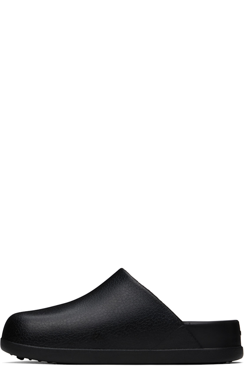 Lightweight textured Croslite™ foam rubber slip-on loafers in black.

· Logo embossed at vamp and heel
· Iconic Crocs Comfort™ molded rubber footbed
· Treaded rubber sole

Supplier color: Black