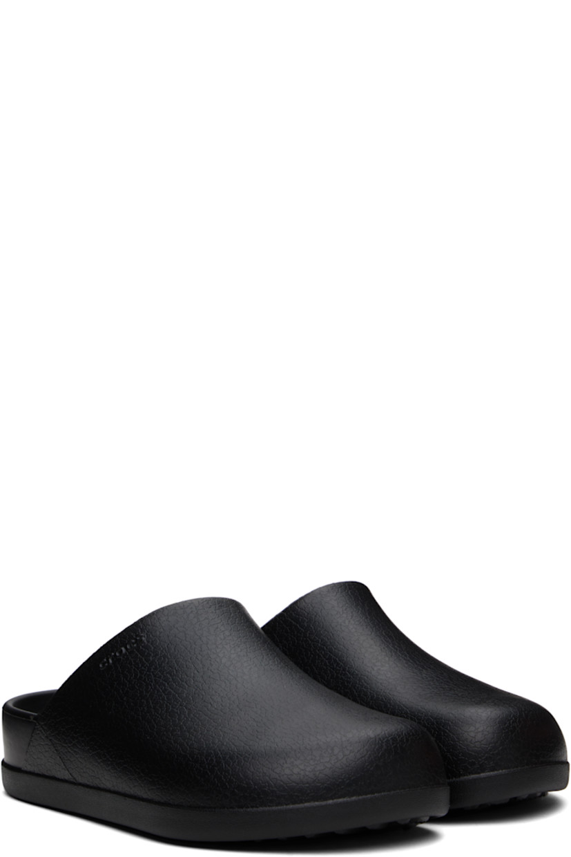 Lightweight textured Croslite™ foam rubber slip-on loafers in black.

· Logo embossed at vamp and heel
· Iconic Crocs Comfort™ molded rubber footbed
· Treaded rubber sole

Supplier color: Black