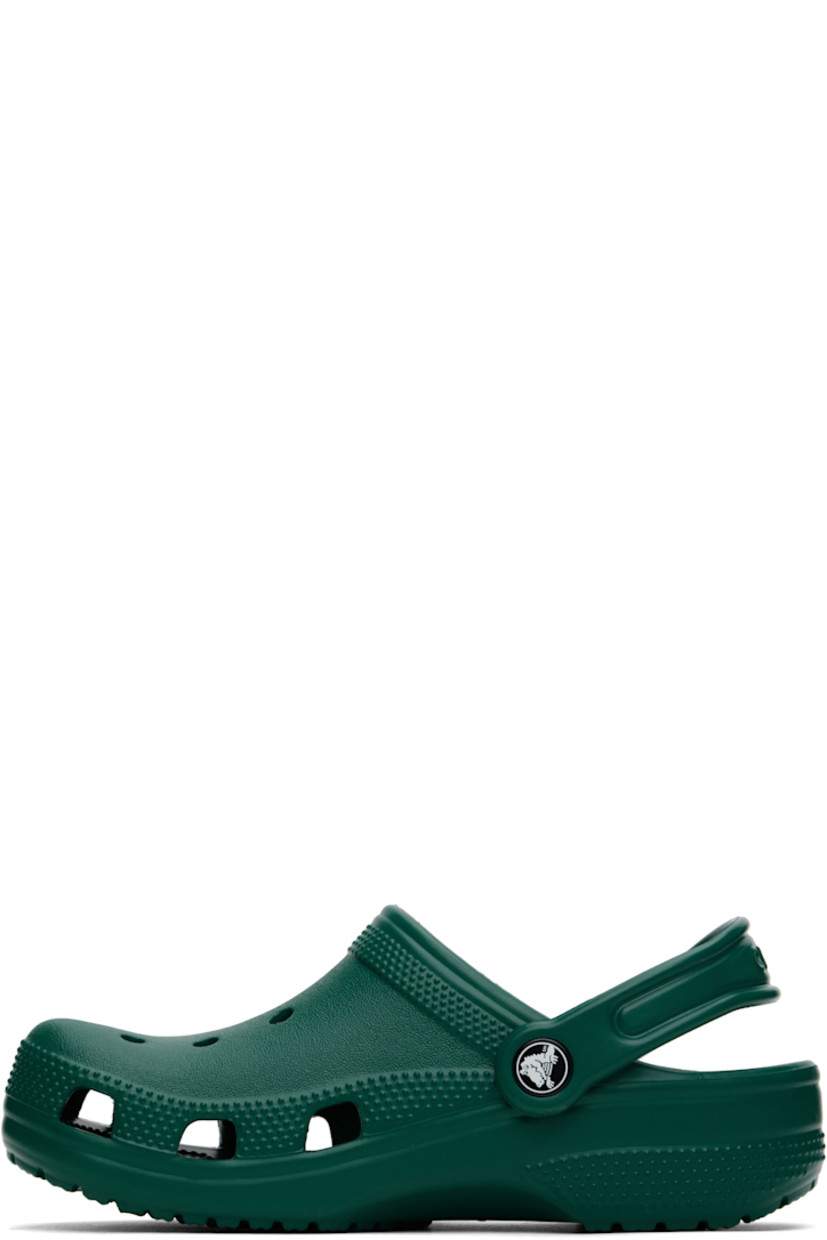 Lightweight Croslite™ foam rubber slip-on loafers in green.

· Perforated detailing at vamp
· Logo embossed at convertible slingback strap
· Crocs Comfort™ molded rubber footbed
· Treaded rubber sole
· Logo-printed hardware

Supplier color: Emerald