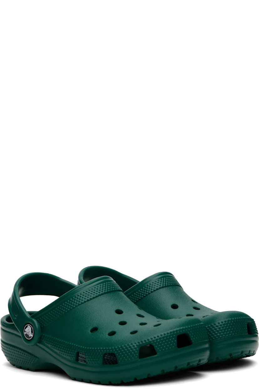 Lightweight Croslite™ foam rubber slip-on loafers in green.

· Perforated detailing at vamp
· Logo embossed at convertible slingback strap
· Crocs Comfort™ molded rubber footbed
· Treaded rubber sole
· Logo-printed hardware

Supplier color: Emerald