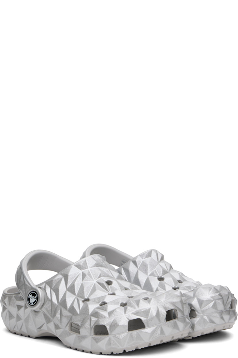 Lightweight sculptural Croslite™ foam rubber slip-on loafers in metallic silver tone. 

· Perforated detailing at vamp
· Logo embossed at convertible slingback strap
· Iconic Crocs Comfort™ molded rubber footbed
· Treaded rubber sole
· Logo-printed hardware

Supplier color: Silver