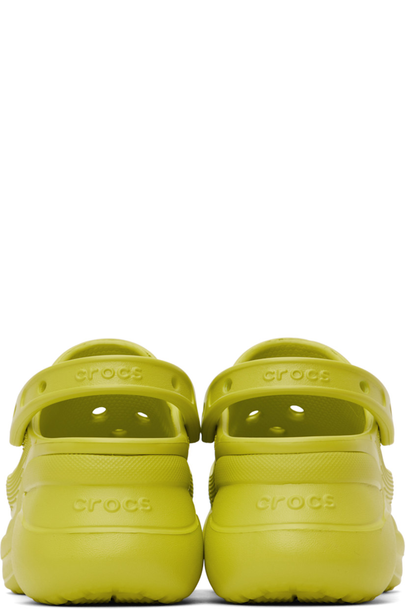 Rubber slip-on loafers in green.

· Perforated detailing throughout
· Logo-embossed convertible slingback strap
· Logo embossed at heel
· Molded rubber footbed
· Sculptural rubber platform midsole
· Treaded rubber sole
· Logo-engraved hardware
· Platform: H3"

Supplier color: Kiwi