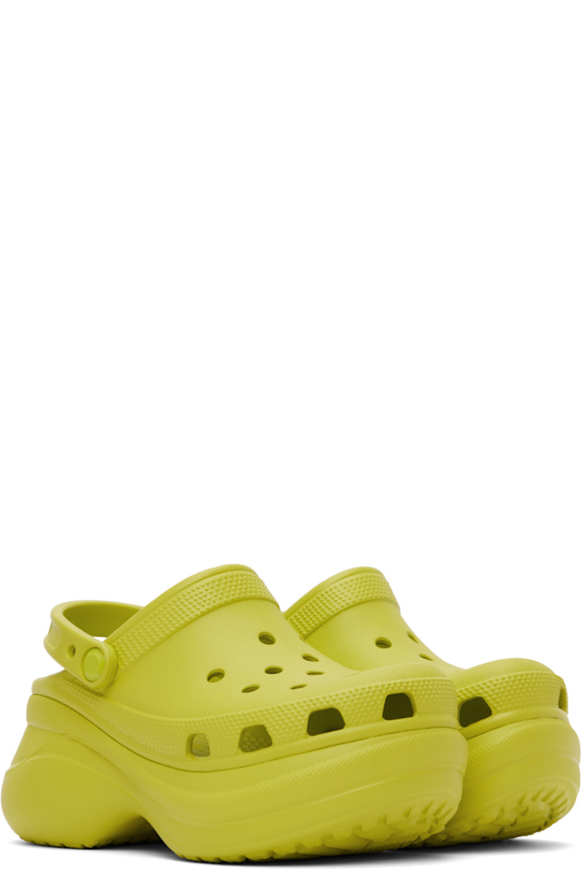 Rubber slip-on loafers in green.

· Perforated detailing throughout
· Logo-embossed convertible slingback strap
· Logo embossed at heel
· Molded rubber footbed
· Sculptural rubber platform midsole
· Treaded rubber sole
· Logo-engraved hardware
· Platform: H3"

Supplier color: Kiwi