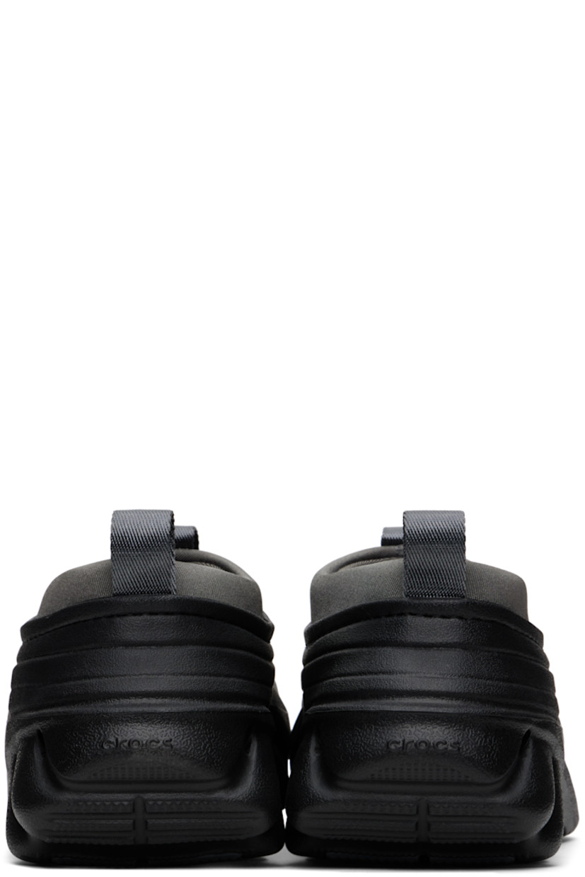 Sculptural rubber slip-on loafers in black.

· Cutouts throughout
· Logo embossed at vamp and heel counter
· Pull-loops at padded jersey collar
· LiteRide™ molded rubber footbed
· Bonded jersey lining
· Treaded rubber sole

Supplier color: Midnight