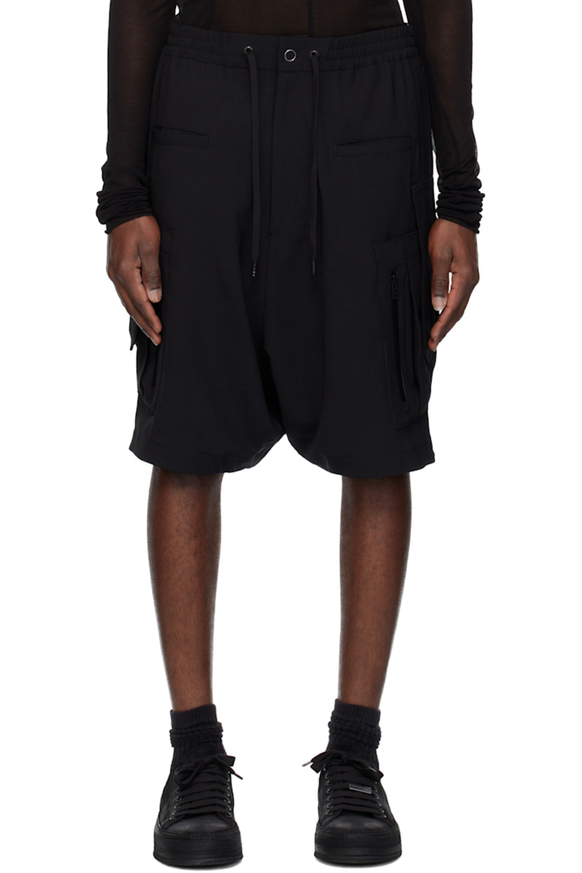 Polyester twill shorts. 

· Paneled construction
· Drawstring at elasticized waistband 
· Four-pocket styling 
· Zip fly 
· Patch and zip pocket at outseams
· Dropped inseam 

Supplier color: Black