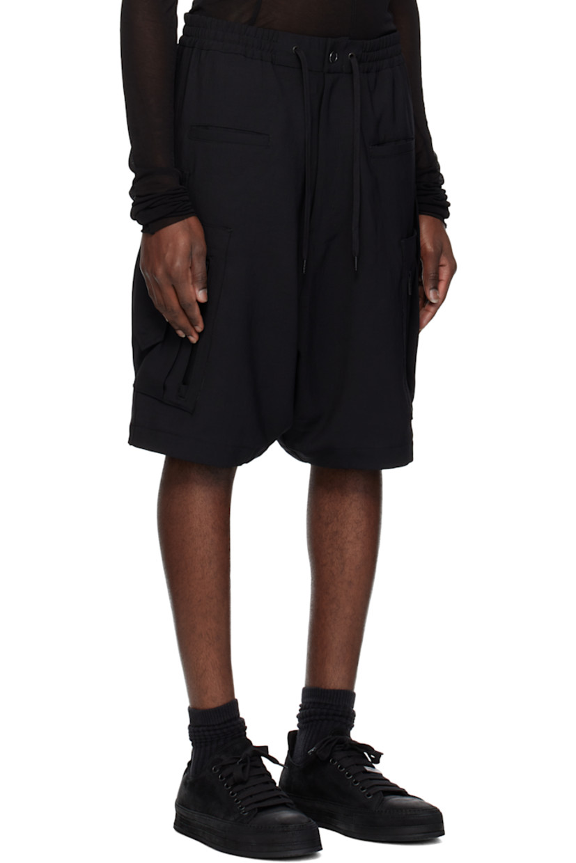 Polyester twill shorts. 

· Paneled construction
· Drawstring at elasticized waistband 
· Four-pocket styling 
· Zip fly 
· Patch and zip pocket at outseams
· Dropped inseam 

Supplier color: Black