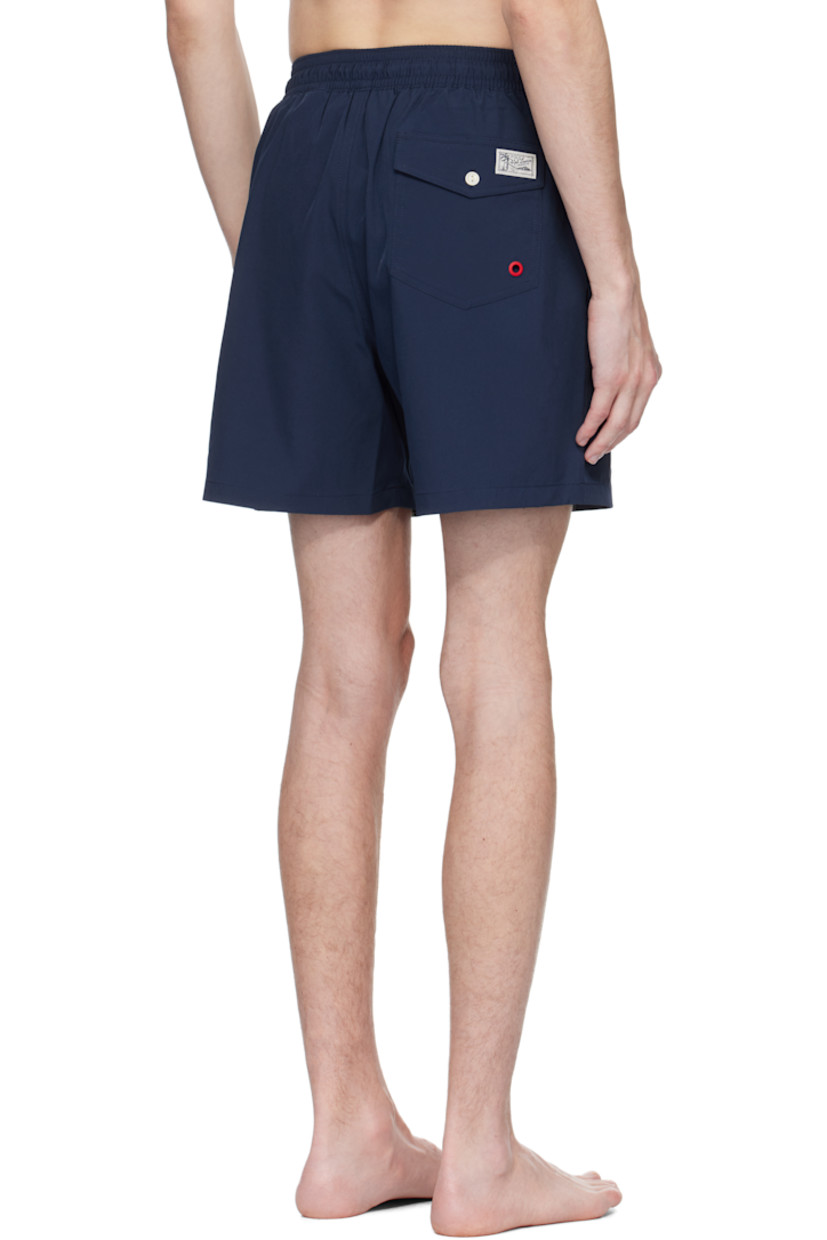 Stretch recycled polyester taffeta swim shorts.

· Drawstring at elasticized waistband
· Three-pocket styling
· Logo bonded at leg
· Logo patch and grommet at back pocket
· Brief-style mesh lining

Supplier color: Newport navy