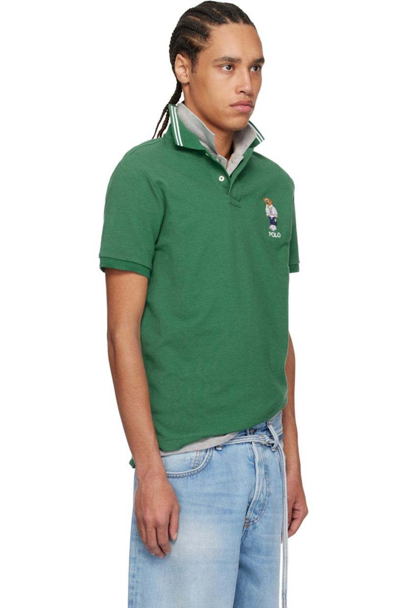 Cotton piqué polo.

· Jacquard stripes at rib-knit spread collar
· Two-button placket
· Logo graphic and text embroidered at chest
· Tennis-tail hem
· Rib-knit cuffs

Supplier color: Green heritage icons