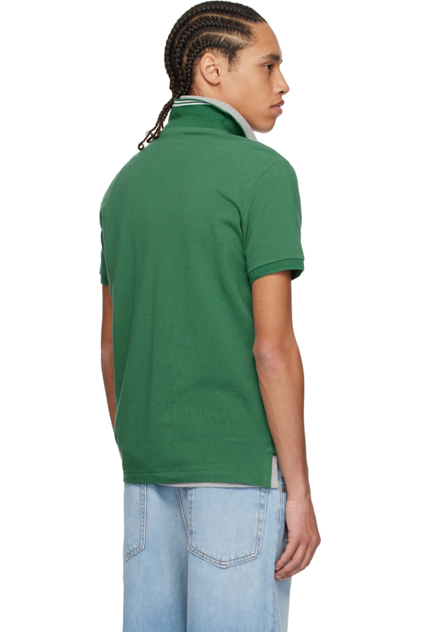 Cotton piqué polo.

· Jacquard stripes at rib-knit spread collar
· Two-button placket
· Logo graphic and text embroidered at chest
· Tennis-tail hem
· Rib-knit cuffs

Supplier color: Green heritage icons
