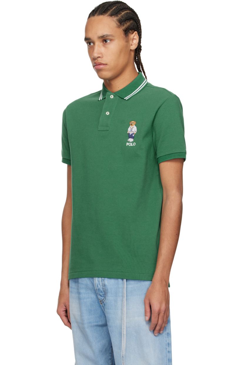 Cotton piqué polo.

· Jacquard stripes at rib-knit spread collar
· Two-button placket
· Logo graphic and text embroidered at chest
· Tennis-tail hem
· Rib-knit cuffs

Supplier color: Green heritage icons
