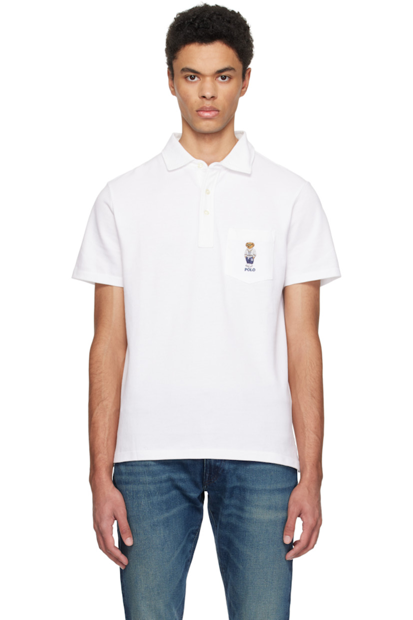 Breathable cotton piqué polo.

· Spread collar 
· Three-button placket
· Logo graphic embroidered at patch pocket
· Tennis-tail hem

Supplier color: White heritage icons