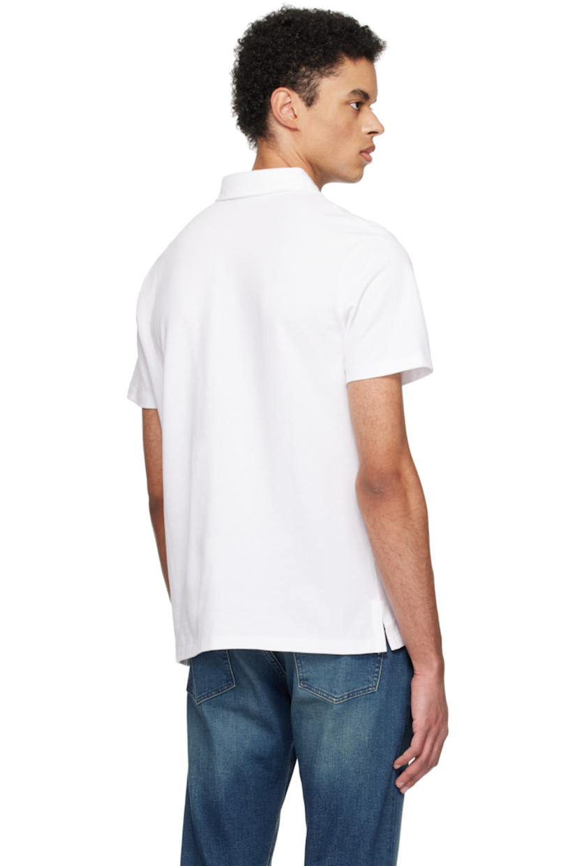 Breathable cotton piqué polo.

· Spread collar 
· Three-button placket
· Logo graphic embroidered at patch pocket
· Tennis-tail hem

Supplier color: White heritage icons
