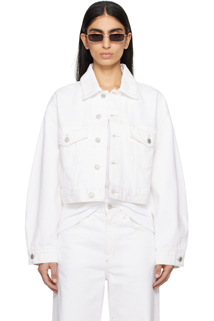 Non-stretch regenerative cotton denim jacket. Subtle distressing throughout.

· Spread collar
· Button closure
· Flap pockets
· Cropped hem
· Dropped shoulders
· Single-button barrel cuffs
· Pleats and adjustable button tabs at back hem
· Logo-engraved silver-tone hardware
· Contrast stitching in tan

Supplier color: Milkshake