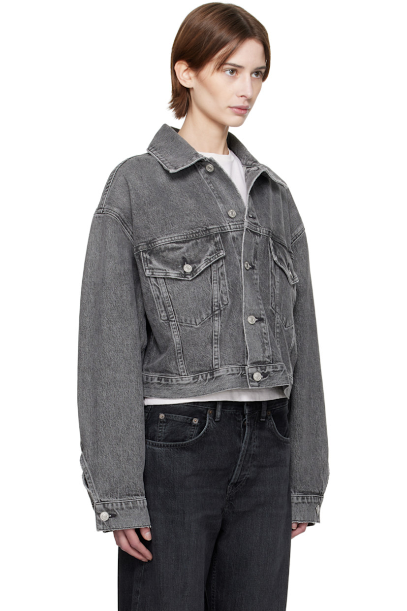 Non-stretch regenerative cotton denim jacket. Fading and subtle distressing throughout.

· Spread collar
· Button closure
· Flap pockets
· Cropped hem
· Dropped shoulders
· Single-button barrel cuffs
· Pleats and adjustable button tabs at back hem

Supplier color: Spirit