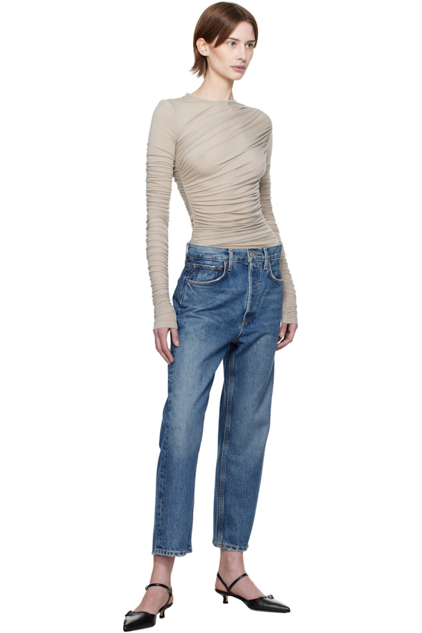 Non-stretch regenerative cotton-blend denim jeans. Fading, whiskering, and subtle distressing throughout.

· Loose-fit and straight-leg
· Mid-rise
· Belt loops
· Five-pocket styling
· Button-fly
· Cropped legs
· Contrasting stitching in tan

Supplier color: Essence