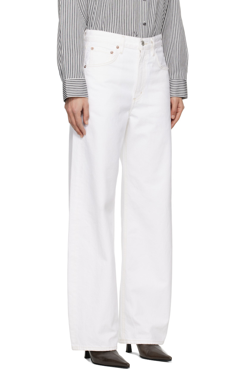 Tapered non-stretch regenerative cotton denim jeans. Subtle distressing throughout.

· Mid-rise
· Belt loops
· Five-pocket styling
· Zip-fly
· Curved outseams
· Logo-engraved silver- and copper-tone hardware
· Contrast stitching in tan

Supplier color: Milkshake