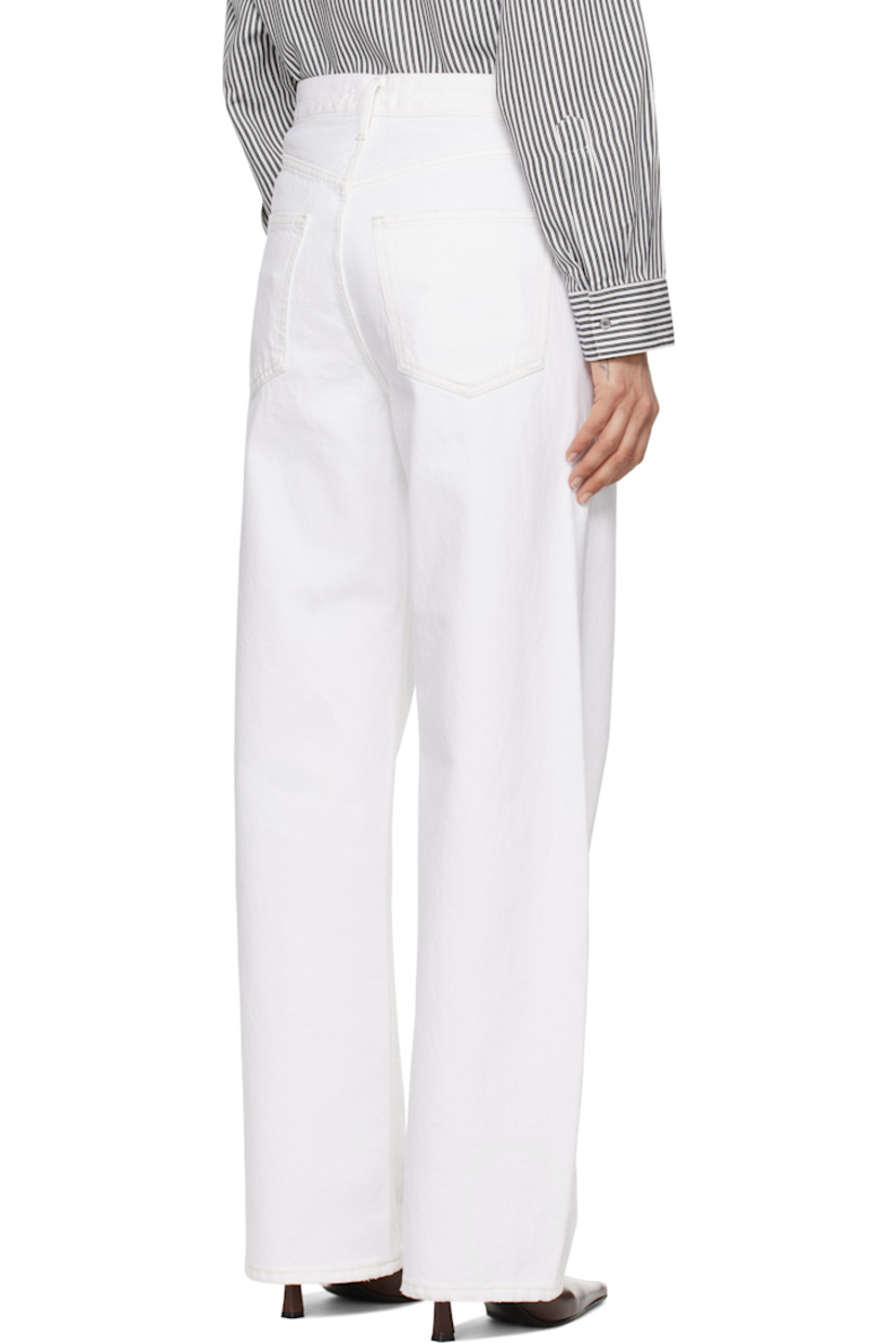 Tapered non-stretch regenerative cotton denim jeans. Subtle distressing throughout.

· Mid-rise
· Belt loops
· Five-pocket styling
· Zip-fly
· Curved outseams
· Logo-engraved silver- and copper-tone hardware
· Contrast stitching in tan

Supplier color: Milkshake