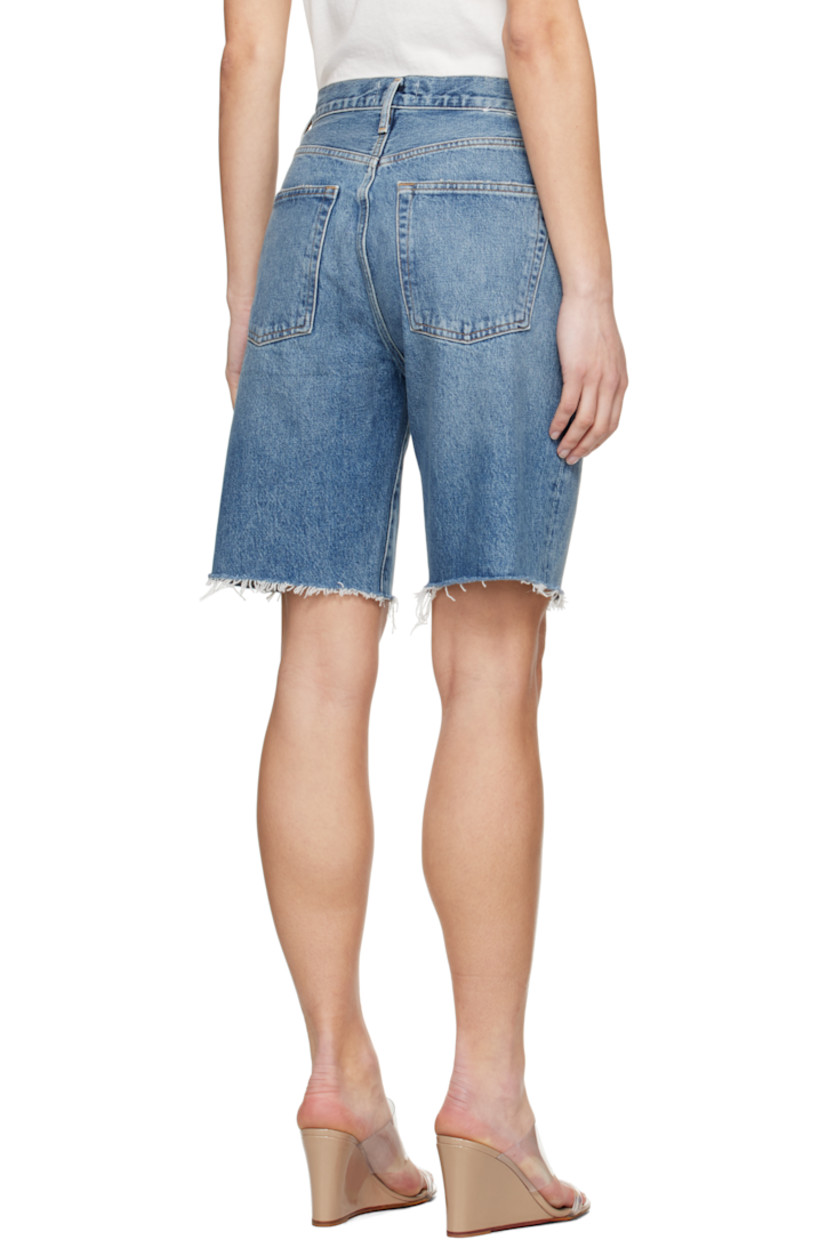 Non-stretch regenerative cotton denim shorts. Fading, whiskering, and subtle distressing throughout.

· Relaxed-fit
· Mid-rise
· Belt loops
· Five-pocket styling
· Button fly
· Frayed edge at cuffs
· Logo-engraved silver- and copper-tone hardware
· Contrast stitching in tan

Supplier color: Ruin
