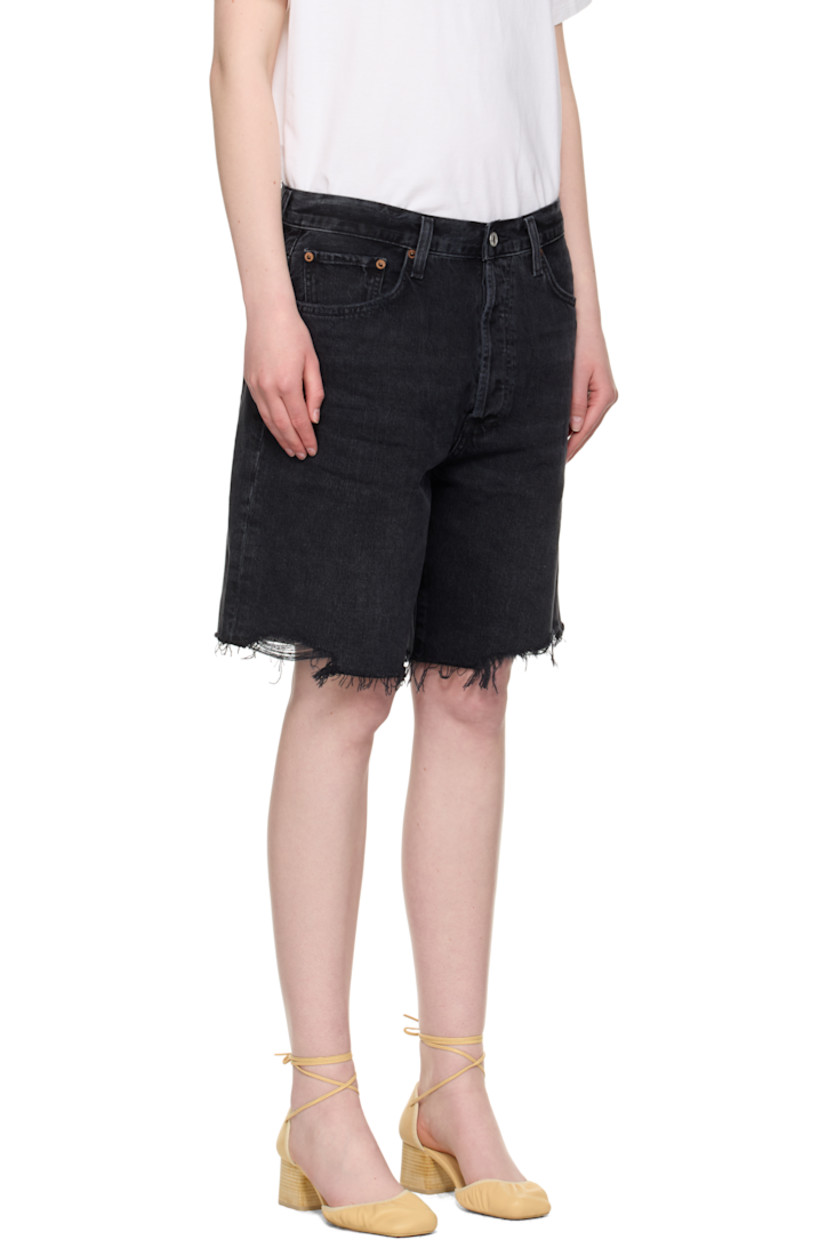 Non-stretch regenerative cotton denim shorts. Fading, whiskering, and subtle distressing throughout. 

· Loose-fit
· Belt loops
· Five-pocket styling
· Button fly 
· Raw edge at hem
· Logo-engraved silver- and bronze-tone hardware

Supplier color: Bounce