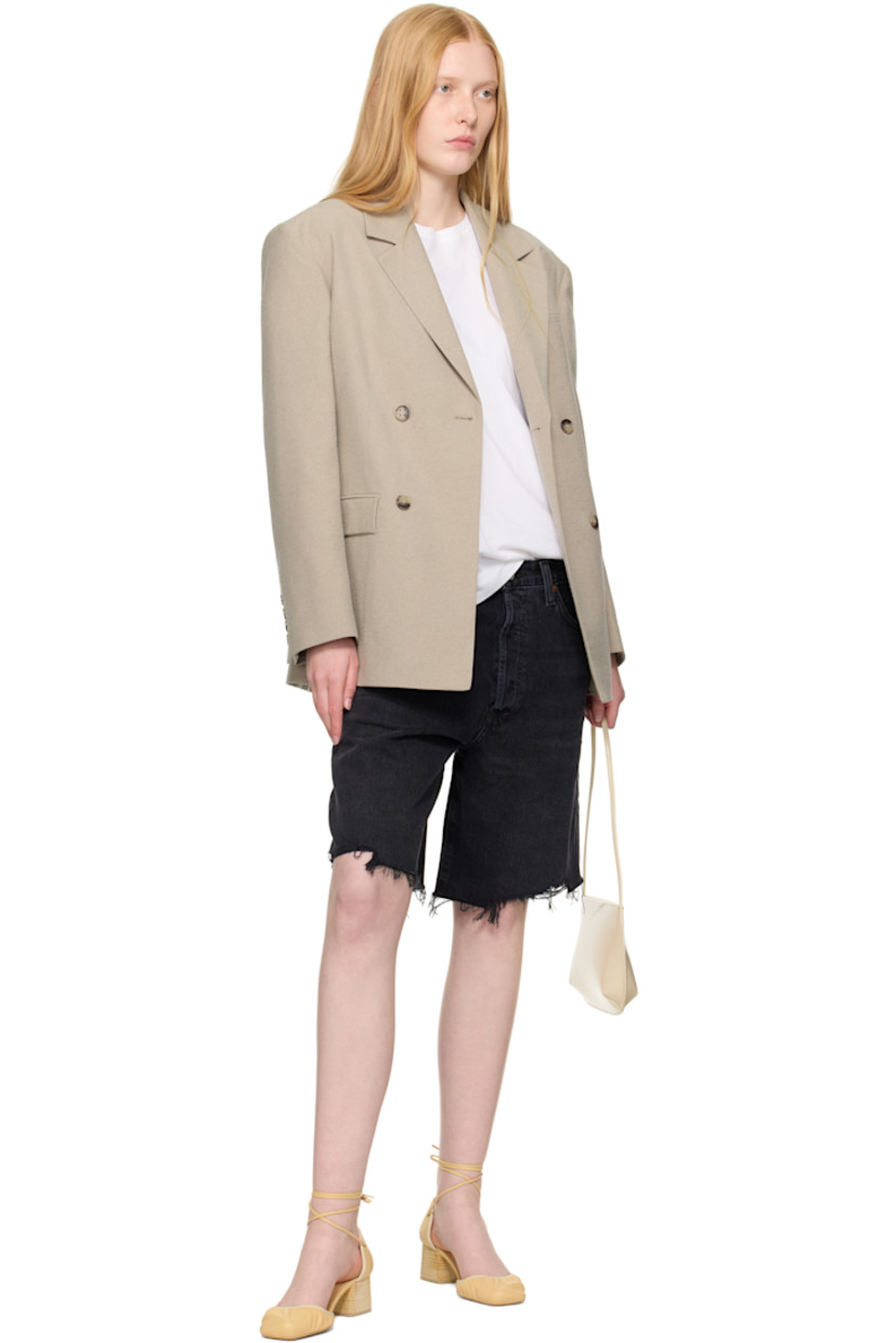 Non-stretch regenerative cotton denim shorts. Fading, whiskering, and subtle distressing throughout. 

· Loose-fit
· Belt loops
· Five-pocket styling
· Button fly 
· Raw edge at hem
· Logo-engraved silver- and bronze-tone hardware

Supplier color: Bounce