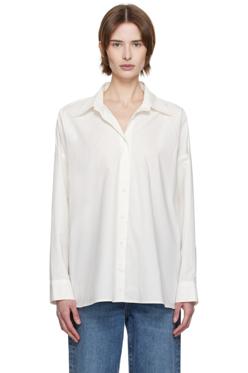 Lightweight cotton poplin shirt. 

· Oversized
· Spread collar
· Button closure
· Droptail hem
· Pleats at single-button barrel cuffs
· Darts at back hem

Supplier color: Rice