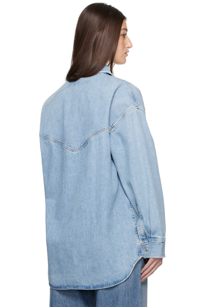 Loose-fit non-stretch regenerative cotton denim shirt. Fading throughout.

· Spread collar
· Press-stud closure
· Flap pockets
· Shirttail hem
· Pleat at press-stud barrel cuffs
· Logo-engraved silver-tone hardware
· Contrast stitching in tan

Supplier color: Drift