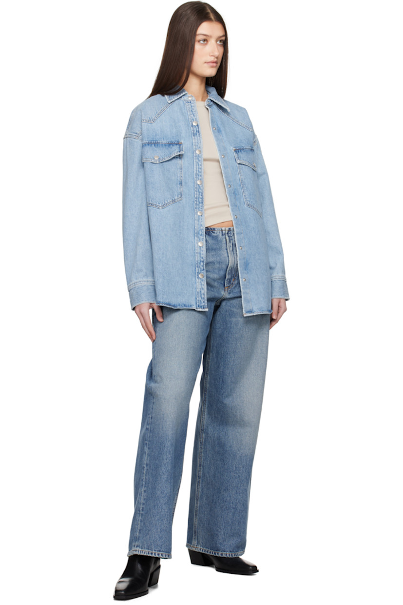 Loose-fit non-stretch regenerative cotton denim shirt. Fading throughout.

· Spread collar
· Press-stud closure
· Flap pockets
· Shirttail hem
· Pleat at press-stud barrel cuffs
· Logo-engraved silver-tone hardware
· Contrast stitching in tan

Supplier color: Drift