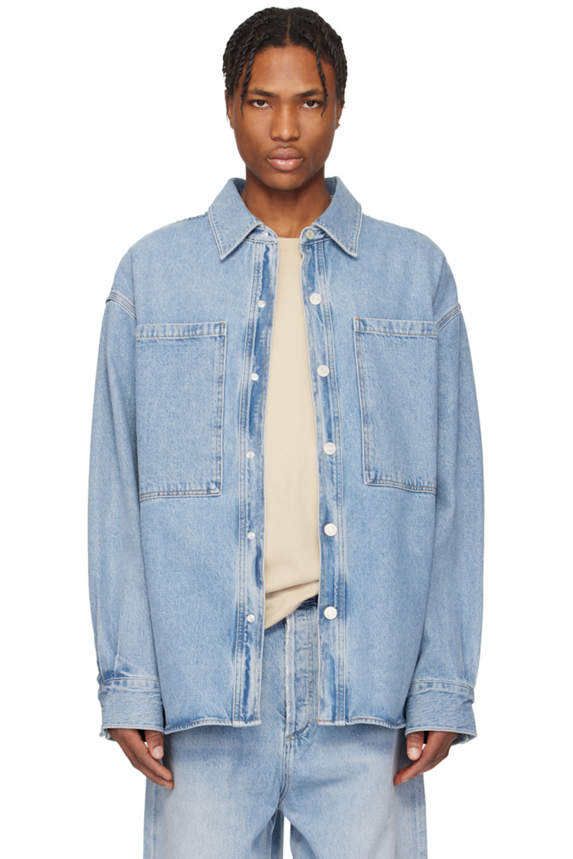 Non-stretch regenerative cotton denim jacket. Fading throughout.

· Spread collar
· Press-stud closure
· Patch pockets
· Shirttail hem 
· Press-stud barrel cuffs
· Twin pleats and locker loop at back yoke
· Logo-engraved silver-tone hardware
· Contrast stitching in tan

Supplier color: Creased indigo