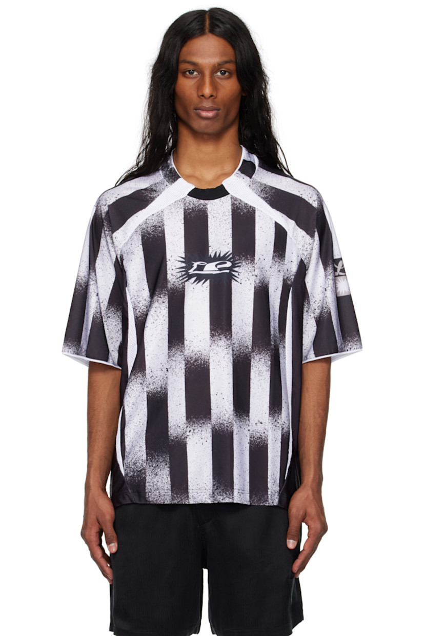 Stretch polyester interlock jersey top. Stripes and mesh trim throughout.

· Rib-knit trim at crewneck
· Logo graphic printed at chest and sleeve
· Droptail hem
· Raglan sleeves

Part of the Le PÈRE x Antonio Carrau collaboration.

Supplier color: Black