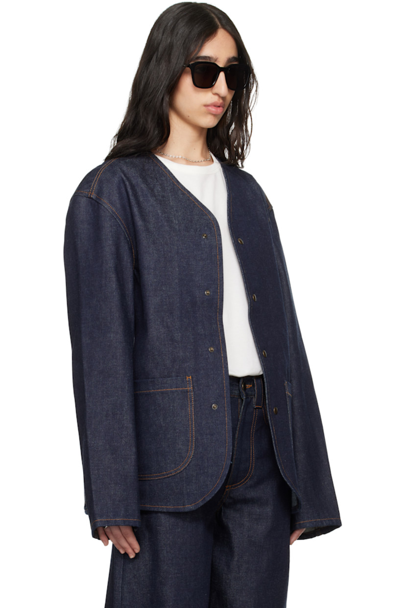 Non-stretch organic cotton denim jacket. 

· Y-neck 
· Press-stud closure 
· Patch pockets 
· Central vent at back hem 
· Patch pocket and logo patch at interior 
· Contrast stitching in tan 

Supplier color: Midnight blue