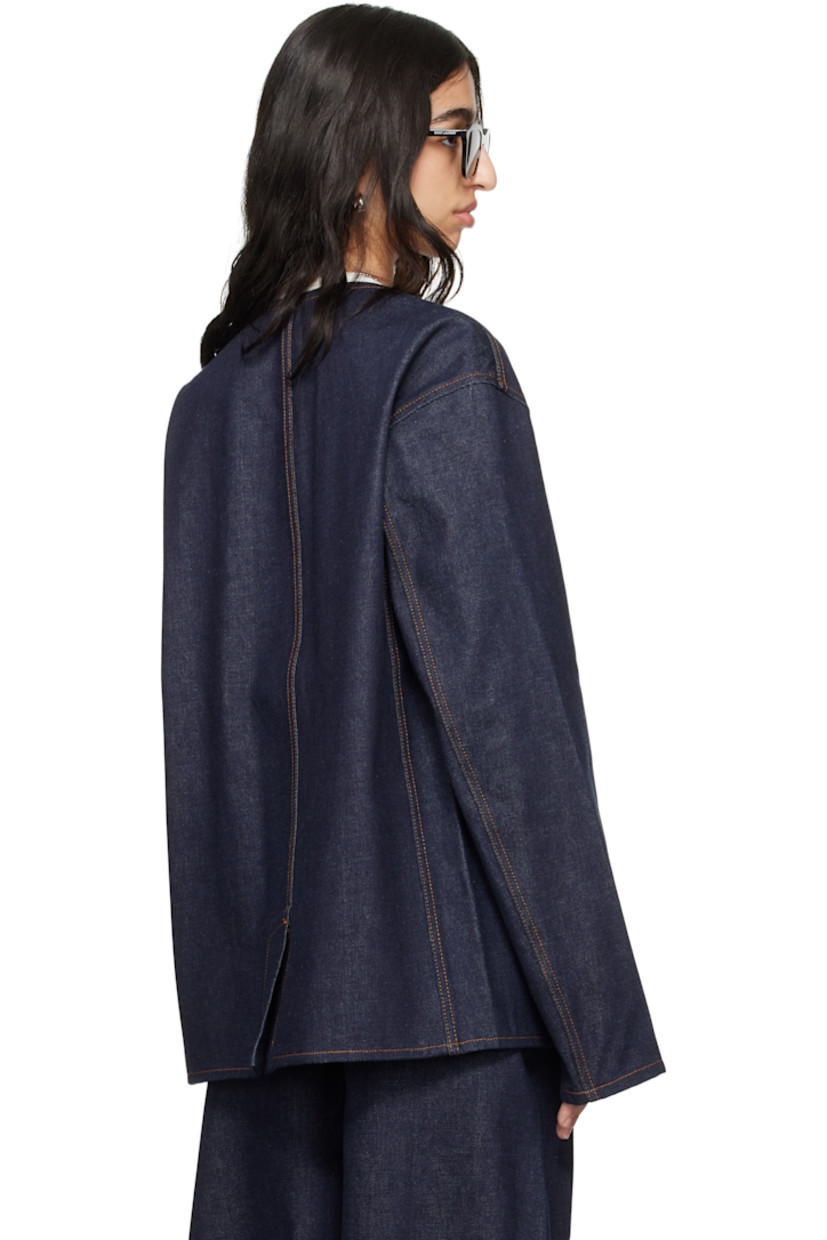 Non-stretch organic cotton denim jacket. 

· Y-neck 
· Press-stud closure 
· Patch pockets 
· Central vent at back hem 
· Patch pocket and logo patch at interior 
· Contrast stitching in tan 

Supplier color: Midnight blue