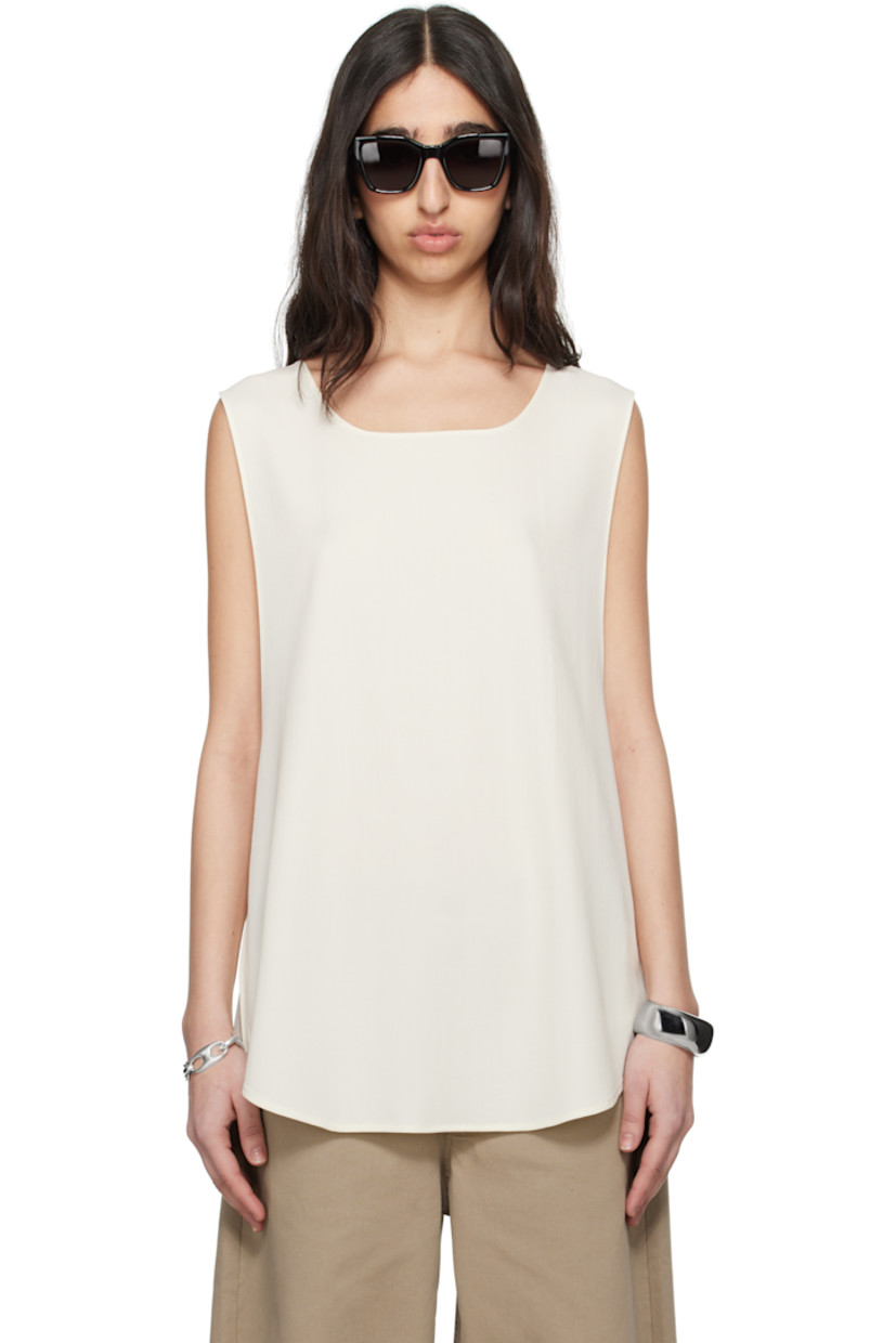 Virgin wool twill top. 

· Scoop neck 
· Droptail hem 
· Dropped armscyes 

Supplier color: White