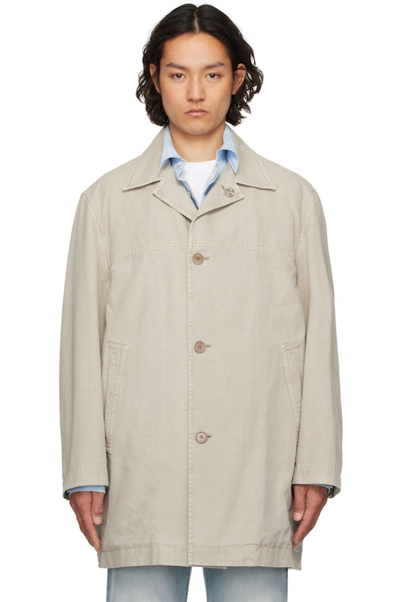 Cotton canvas coat.

· Detachable logo hardware at open spread collar
· Button closure
· Welt pockets
· Buttoned vent at side seams
· Dropped shoulders
· Adjustable button tab at cuffs
· Patch pockets at interior
· Partial cotton twill lining

Supplier color: Khaki